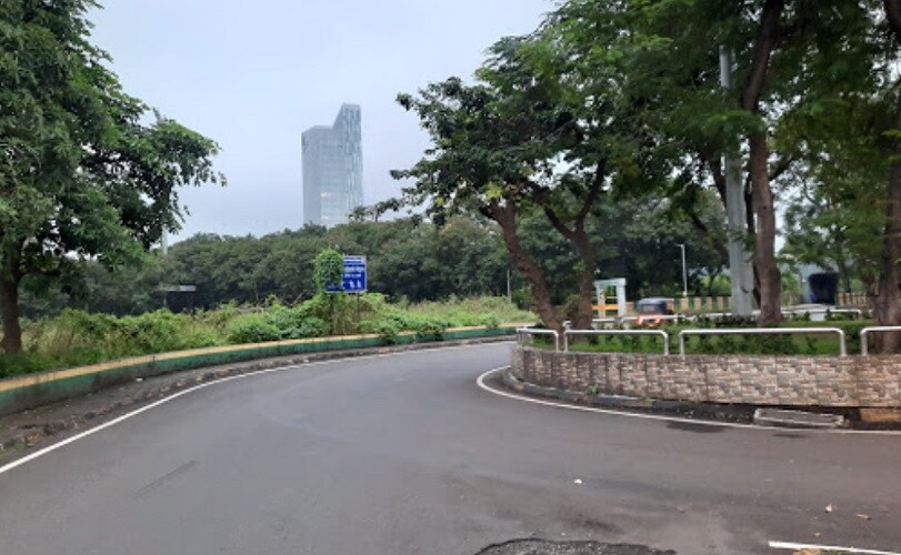 Vashi Sector 6_a road that has some trees on it